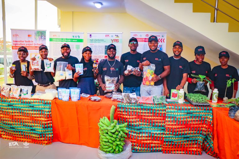 : A group photograph of some beneficiaries supported by the IITA Youth Agripreneurs projects with their products