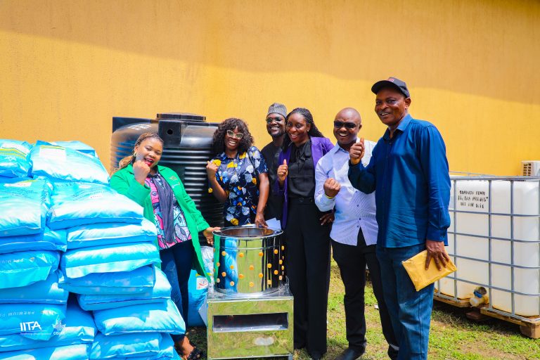 Participants of the YAS project receiving input support for their aquaculture enterprises, presented by Ms. Aline Mugisho, YAS Project Team Lead